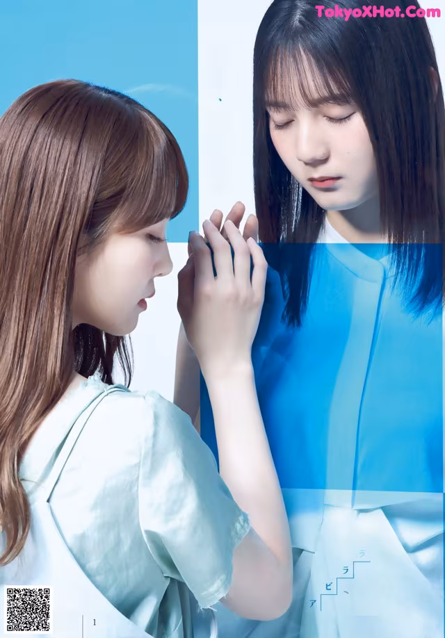A couple of young women standing next to each other.